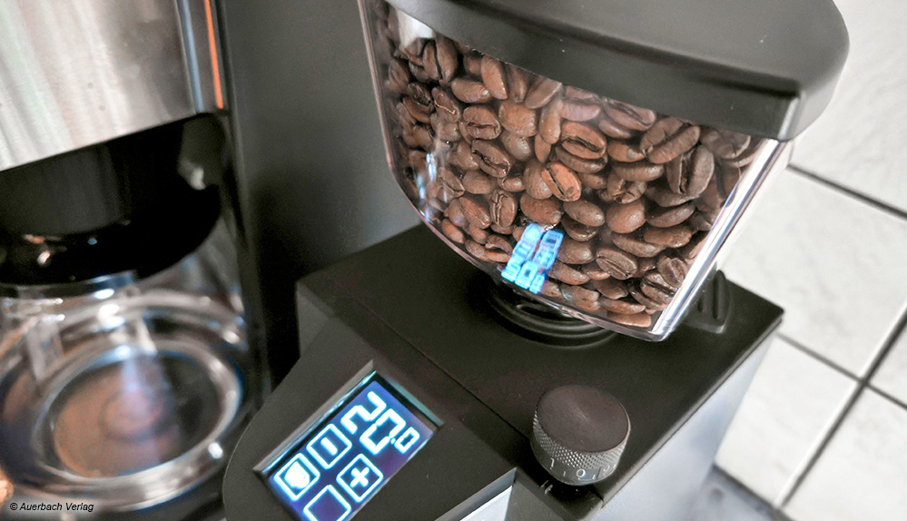Optimale Version einer Kaffeemühle: Oben mit luftdichtem Vorratsbehälter, rechts mit einem Drehschalter für den Mahlgrad sowie einem Touch-LED-Display 
