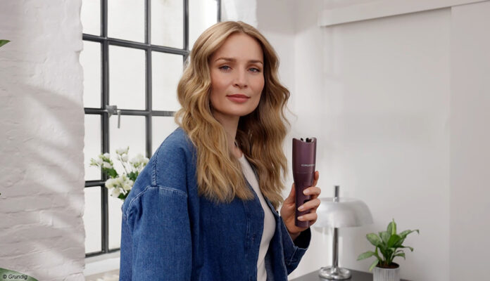 Frau mit Grundig Hairstyling-Tools